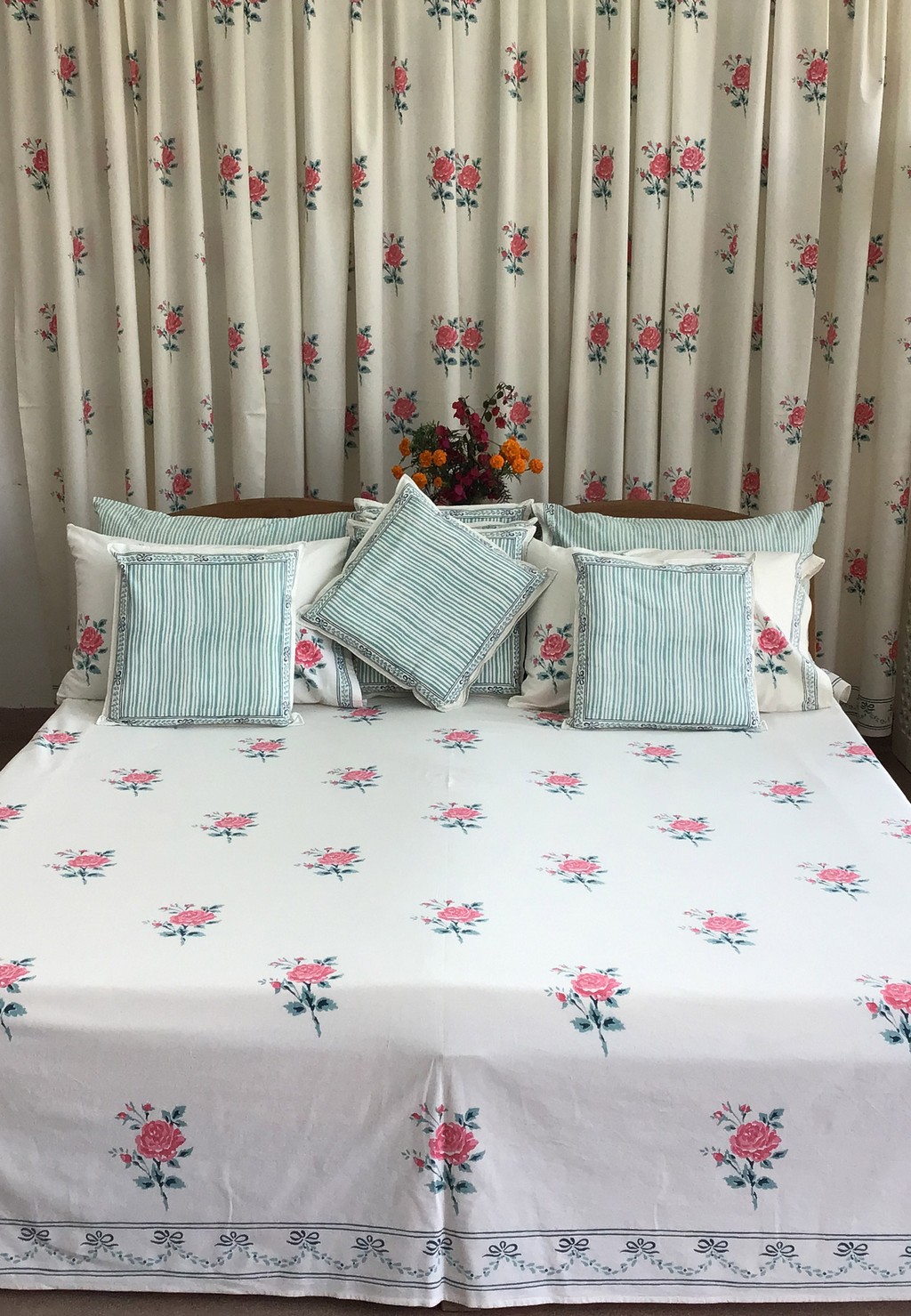 White bedspreads with pink flower